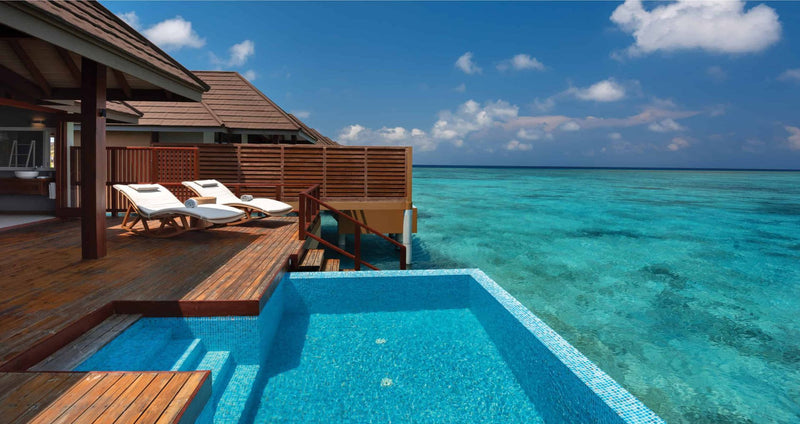VARU by Atmosphere, North Malé Atoll: the pool and loungers on a water villa deck