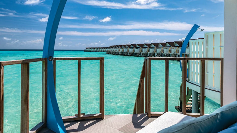 OBLU Xperience Ailafushi, North Malé Atoll: the deck of a Water Villa, looking along the overwater villas