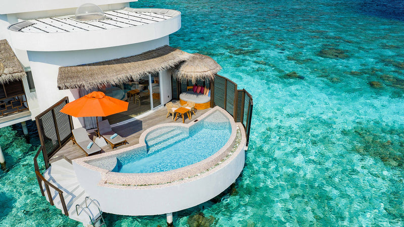 OBLU SELECT Sangeli, North Malé Atoll: from above, a round overwater villa with a curved pool on its deck