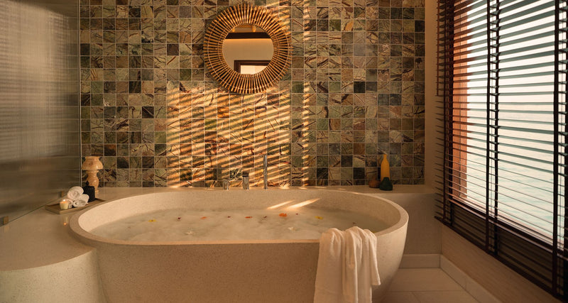 A bathroom with a freestanding tub at RAH GILI Maldives.