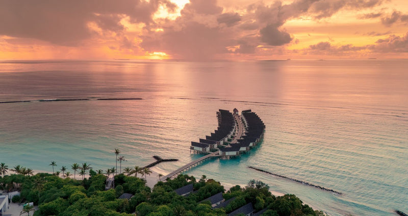 RAAYA by Atmosphere, Raa Atoll: the end of a water villa jetty at sunset