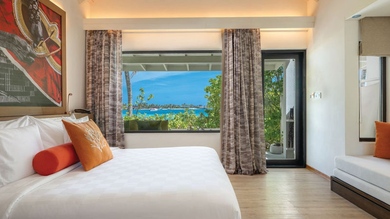OBLU Xperience Ailafushi, North Malé Atoll: a Beach Villa bedroom with a window onto the sea
