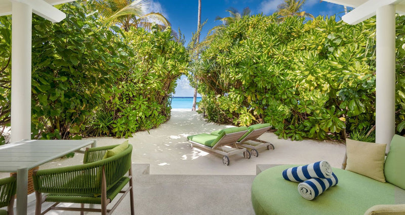 RAAYA by Atmosphere, Raa Atoll: a beach villa terrace with loungers and a path to the sea