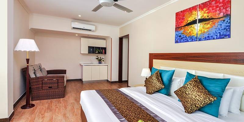 Double room at Triton Beach Hotel with a balcony door
