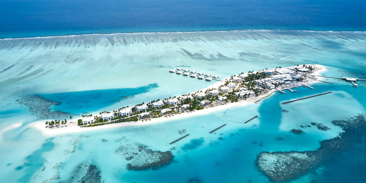 Hotel Riu Atoll from the air, the island and its surrounding shallows.