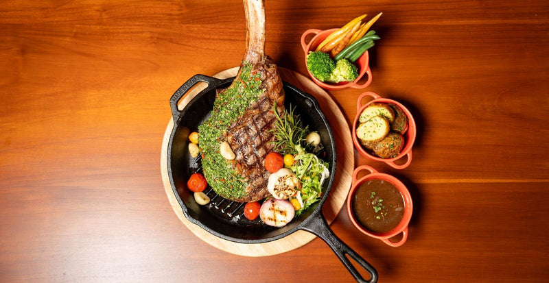 OBLU SELECT Sangeli, North Malé Atoll: a grilled steak in a cast-iron pan with small sides