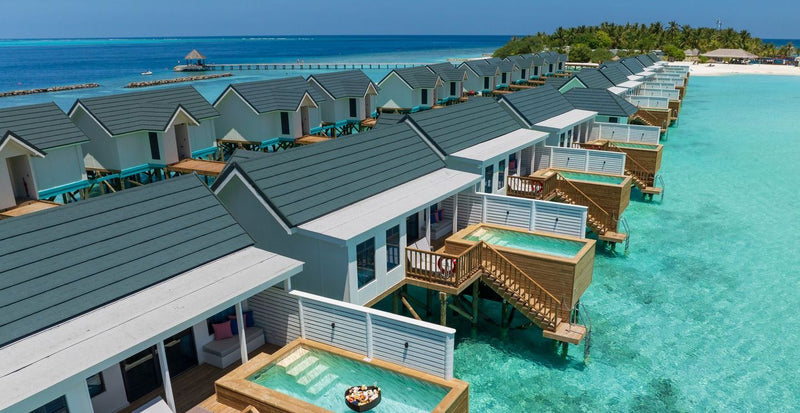OBLU NATURE Helengeli by SENTIDO, North Malé Atoll: from the air, the row of water villas with pools along the lagoon, the island behind