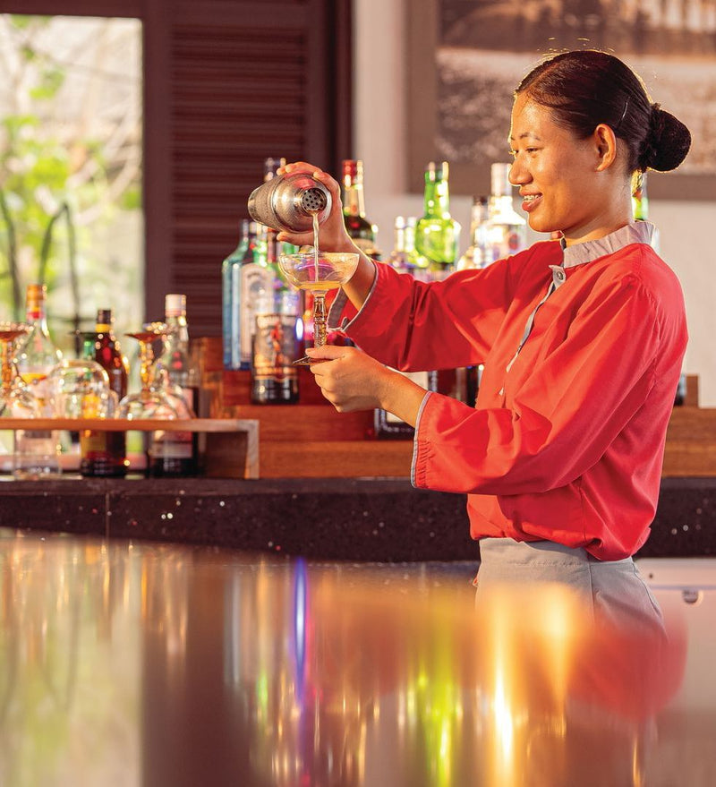 OBLU Xperience Ailafushi, North Malé Atoll: a bartender pouring a drink