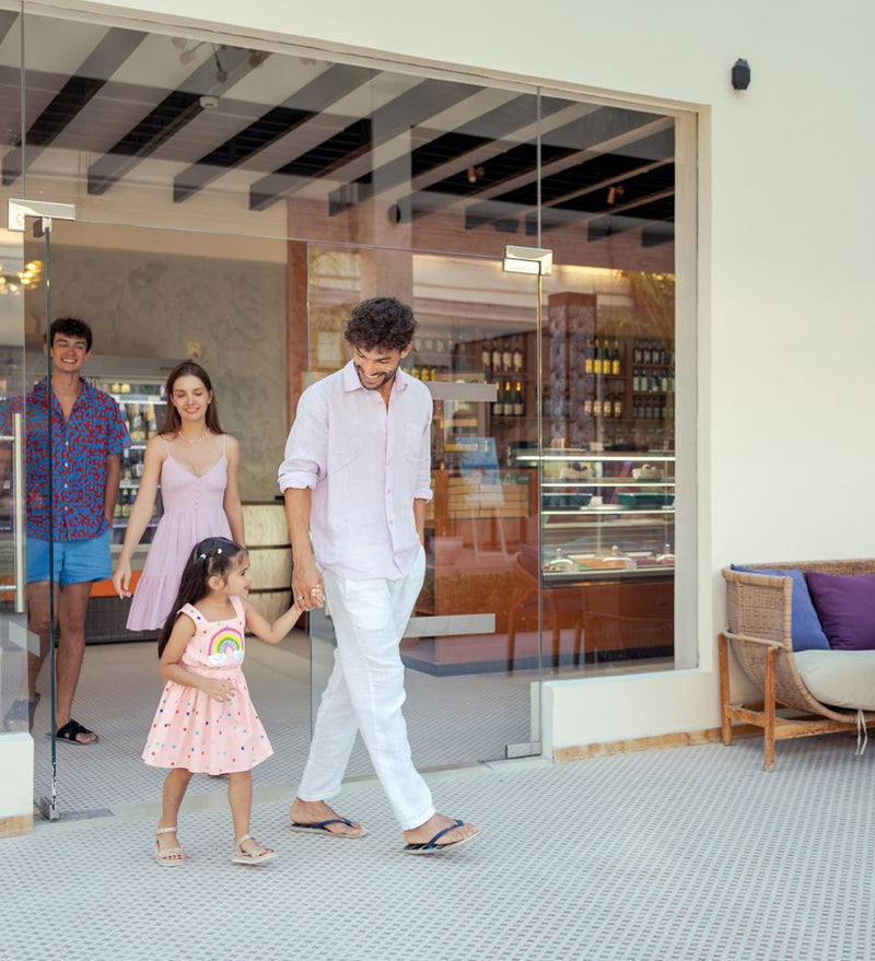 OBLU Xperience Ailafushi, North Malé Atoll: a family choosing pastries at a shop counter