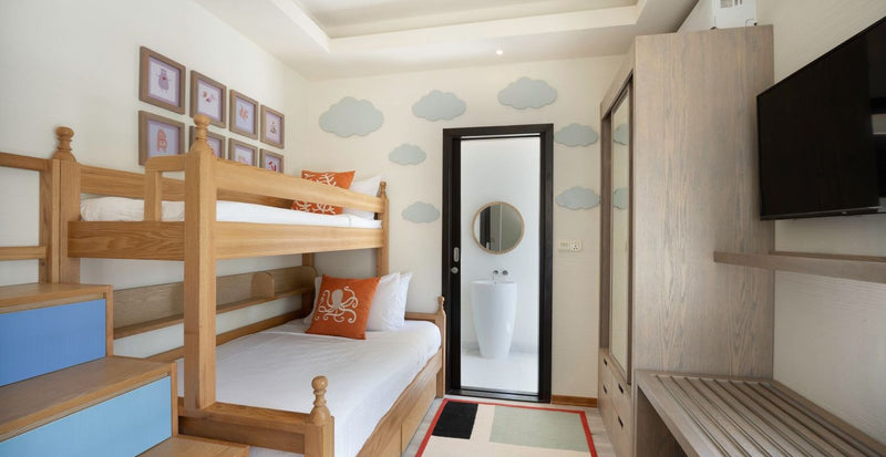 OBLU Xperience Ailafushi, North Malé Atoll: a children's room with bunk beds and its own bathroom