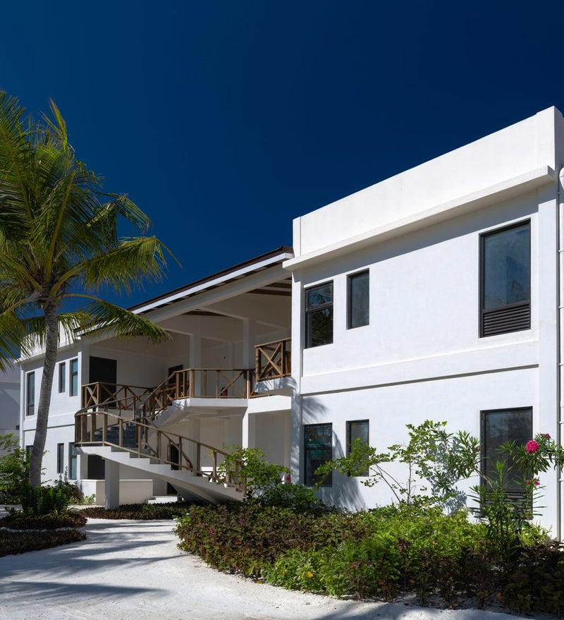 OBLU Xperience Ailafushi, North Malé Atoll: a two-storey room building among the palms