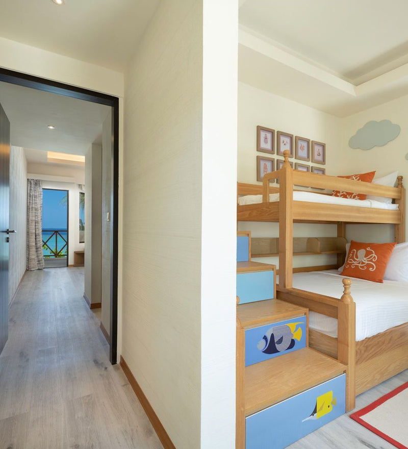 OBLU Xperience Ailafushi, North Malé Atoll: a children's room with bunk beds, off a corridor