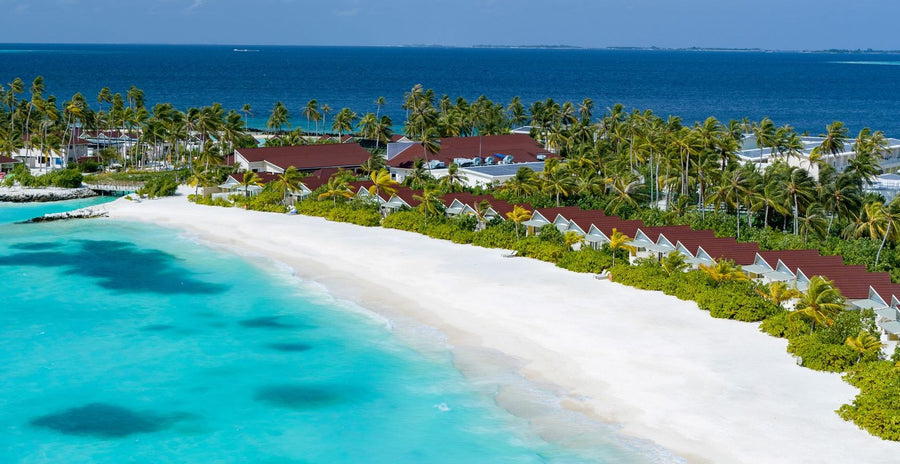 OBLU Xperience Ailafushi, North Malé Atoll: the beach and the island's villas from the air
