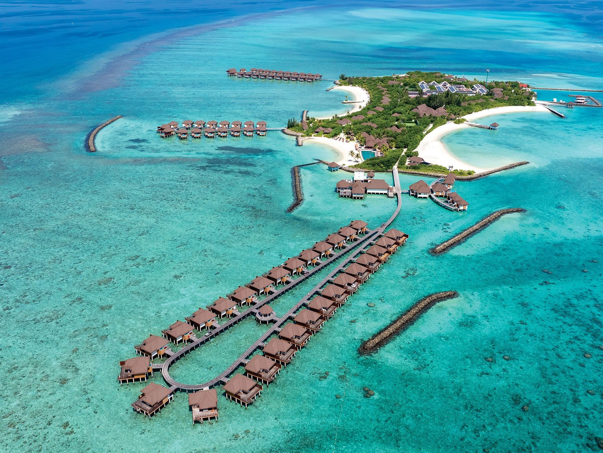 VARU by Atmosphere, North Malé Atoll: the island from the air, with its water villa jetties and breakwaters