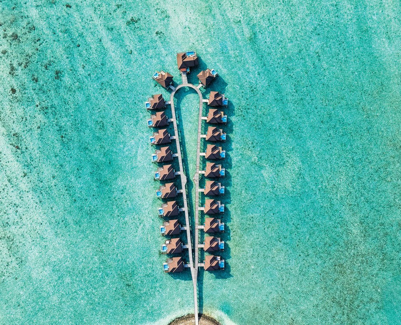 VARU by Atmosphere, North Malé Atoll: from above, the loop of water villas on their jetty