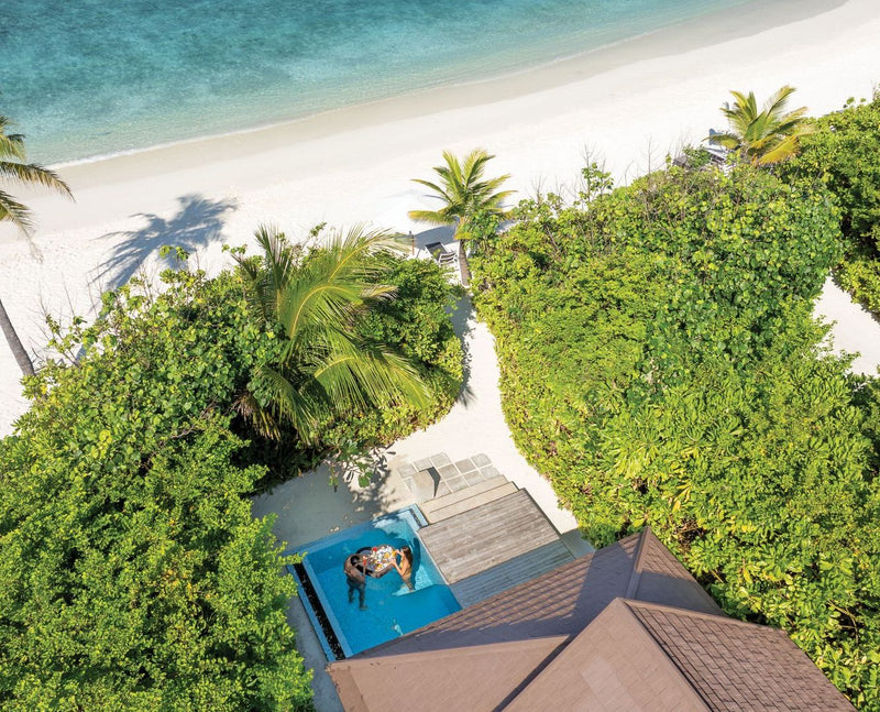 VARU by Atmosphere, North Malé Atoll: from above, a beach villa with a private pool among the trees