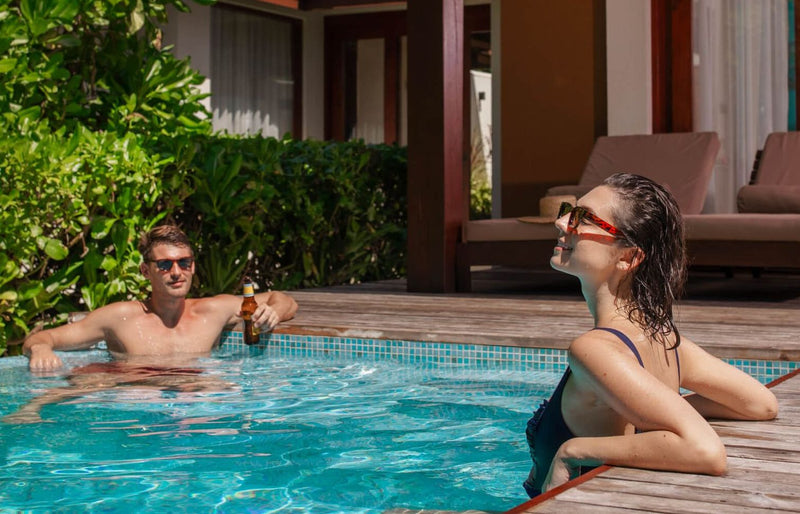 VARU by Atmosphere, North Malé Atoll: a couple in the private pool of a beach villa