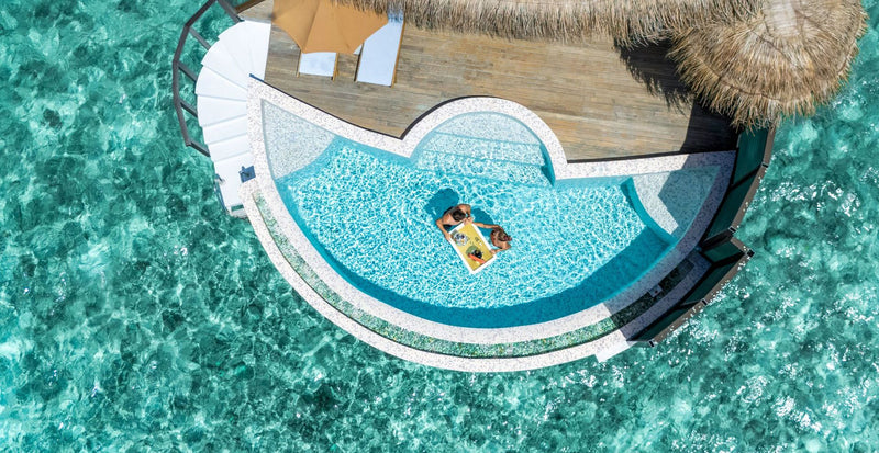 OBLU SELECT Sangeli, North Malé Atoll: from above, the curved plunge pool and deck of an overwater pool villa