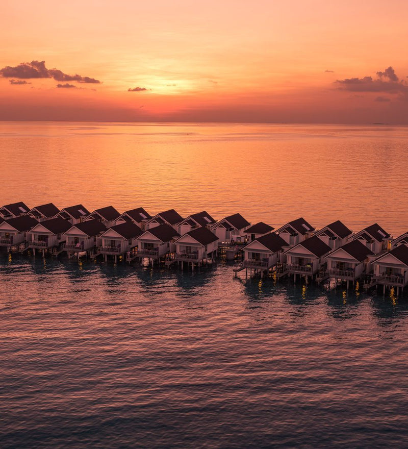 OBLU SELECT Lobigili, North Malé Atoll: the overwater villas at sunset