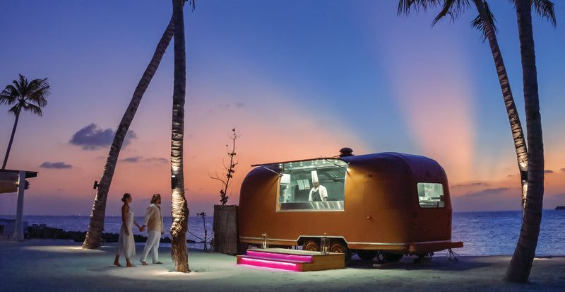 OBLU SELECT Lobigili, North Malé Atoll: a food truck on the beach at dusk