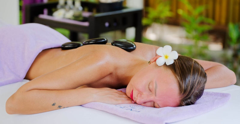 OBLU NATURE Helengeli by SENTIDO, North Malé Atoll: a guest having a hot stone massage at the spa