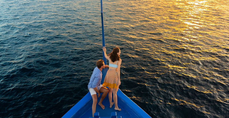 OBLU NATURE Helengeli by SENTIDO, North Malé Atoll: a couple on the bow of a traditional boat at sunset