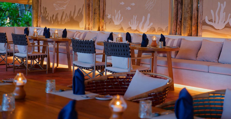 OBLU NATURE Helengeli by SENTIDO, North Malé Atoll: a candlelit restaurant with coral motifs on the walls