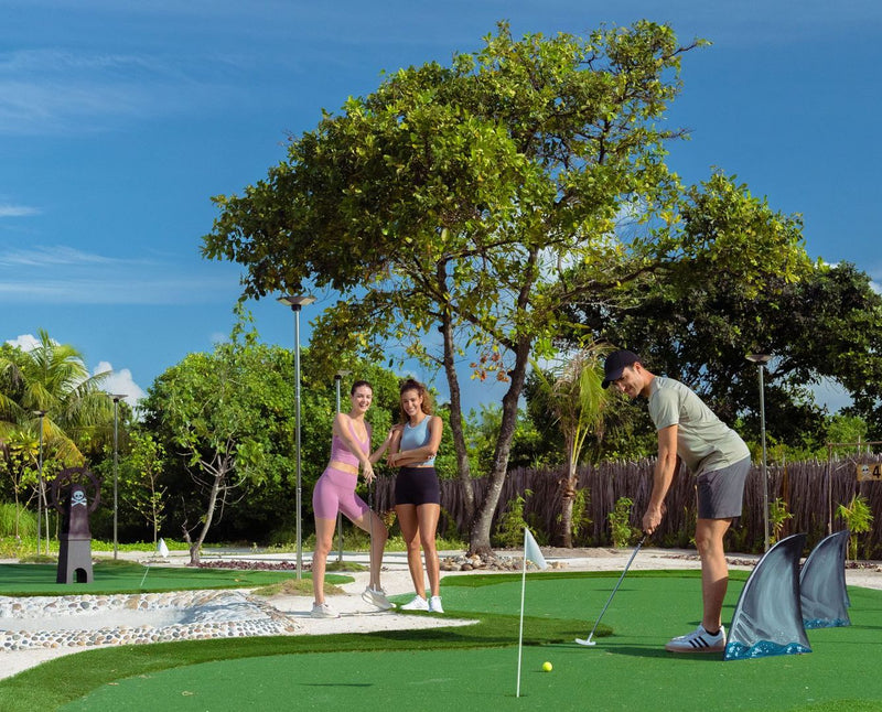 RAAYA by Atmosphere, Raa Atoll: a family playing mini golf under the trees