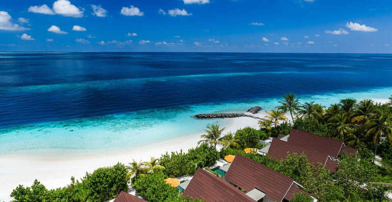 OBLU SELECT Lobigili, North Malé Atoll: the beach and villa roofs from the air