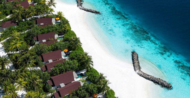 OBLU SELECT Lobigili, North Malé Atoll: beach villas along the shoreline, from the air