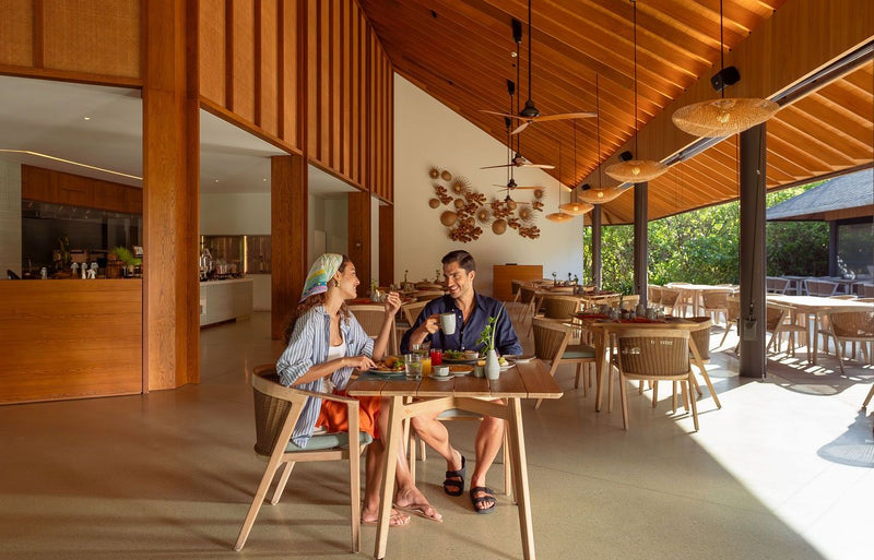 RAAYA by Atmosphere, Raa Atoll: a couple at breakfast in the all-day restaurant
