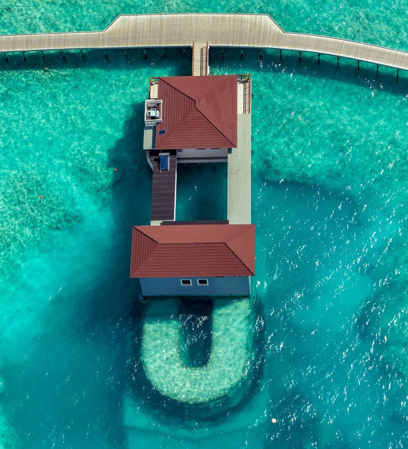 OBLU Xperience Ailafushi, North Malé Atoll: an overwater villa seen from directly above