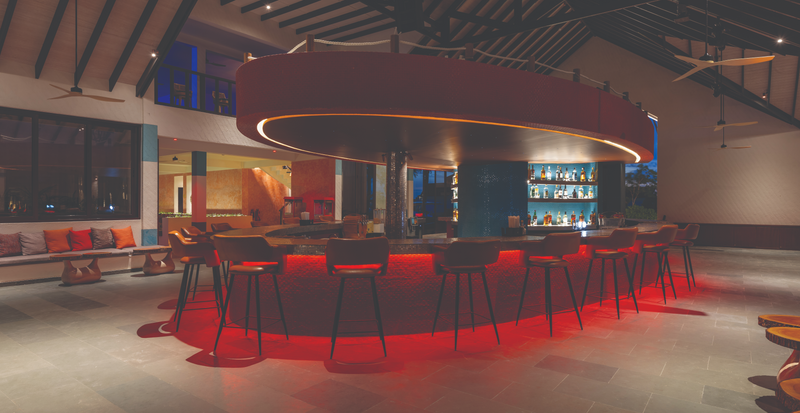 OBLU Xperience Ailafushi, North Malé Atoll: a bar lit in red at night