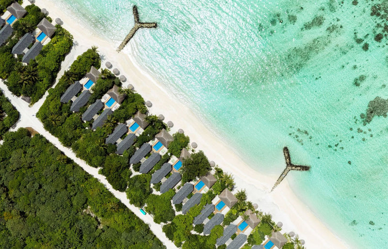 RAAYA by Atmosphere, Raa Atoll: from above, beach villas with pools behind the beach
