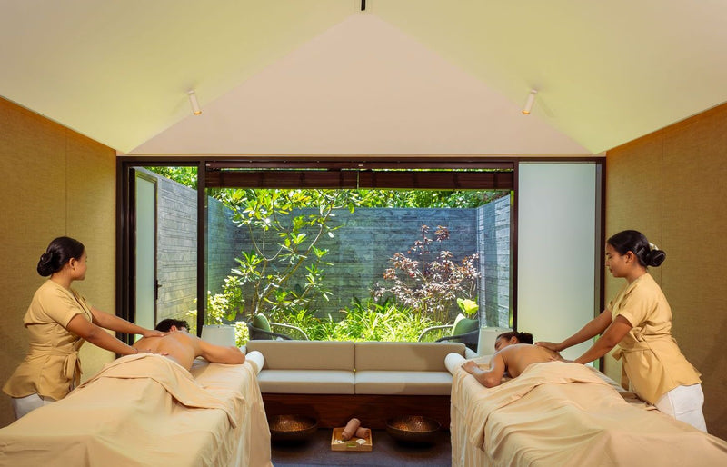 RAAYA by Atmosphere, Raa Atoll: a couple having massages side by side at the spa