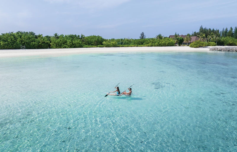 VARU by Atmosphere, North Malé Atoll: two guests in a kayak on the lagoon