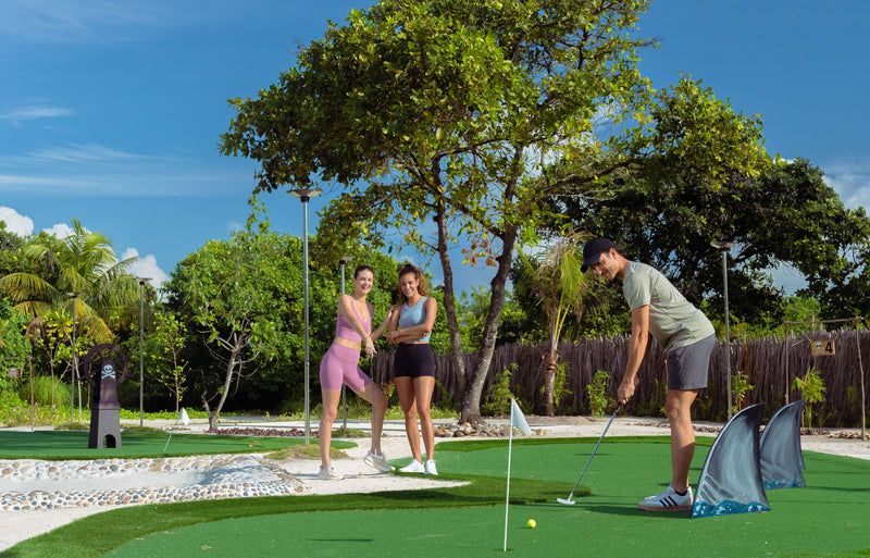 RAAYA by Atmosphere, Raa Atoll: a family putting on the mini golf course
