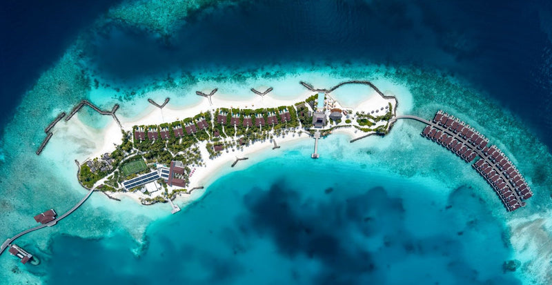OBLU SELECT Lobigili, North Malé Atoll: the whole island with its overwater villas, from the air