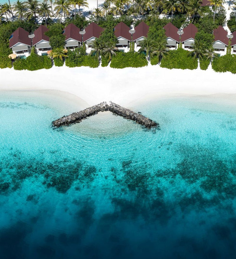 OBLU SELECT Lobigili, North Malé Atoll: a breakwater in the lagoon, from the air