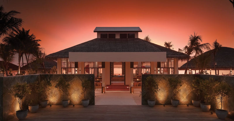 OBLU SELECT Lobigili, North Malé Atoll: a pavilion lit up at dusk