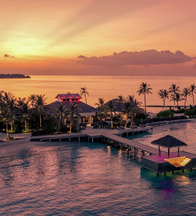 OBLU SELECT Lobigili, North Malé Atoll: the pool bar at dusk