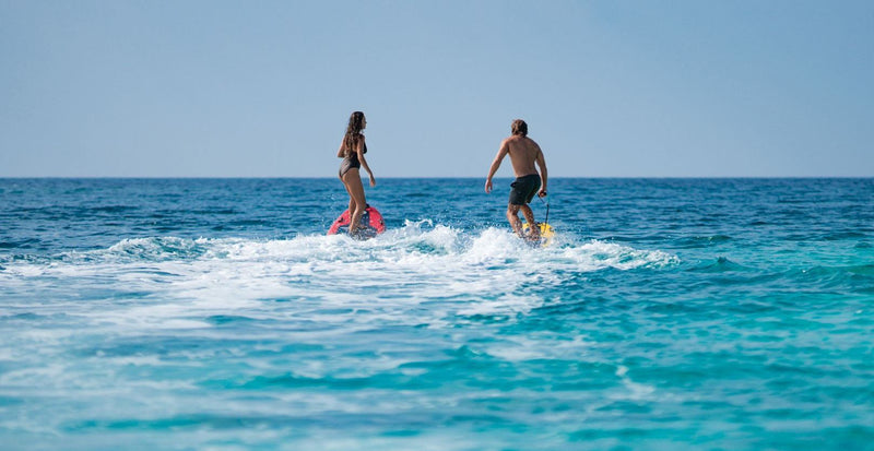 OBLU SELECT Lobigili, North Malé Atoll: two guests riding hydrofoil boards