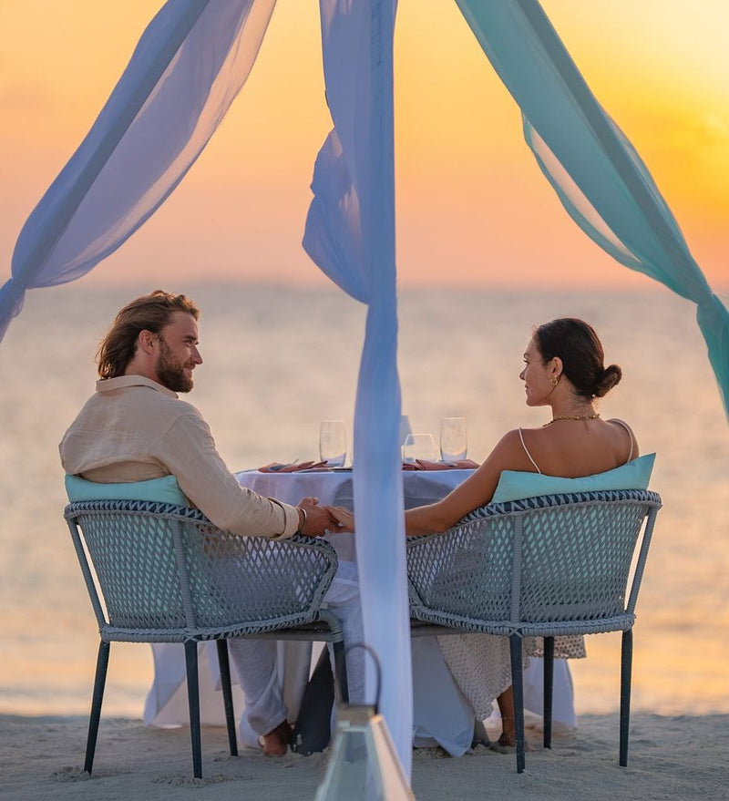 OBLU SELECT Lobigili, North Malé Atoll: a couple at a private dinner on the beach
