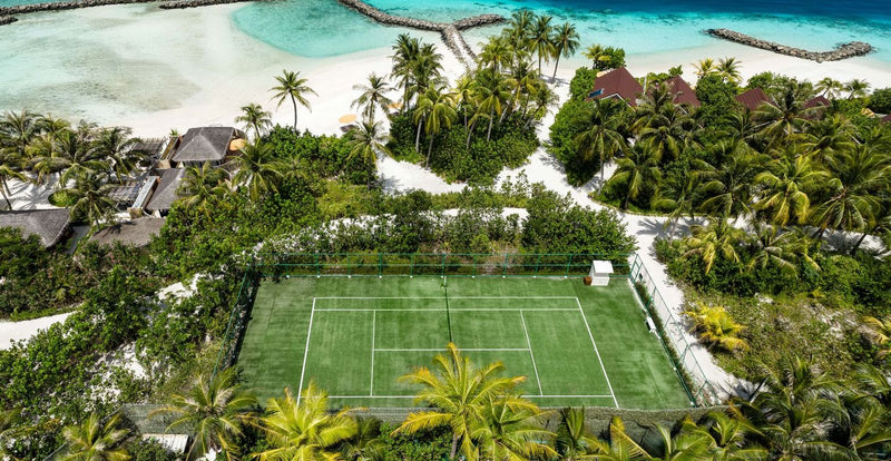 OBLU SELECT Lobigili, North Malé Atoll: the tennis court among the palms, from the air
