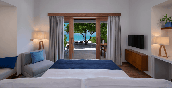 The bedroom of a Sunset Beach Villa at Ifuru Island Maldives.