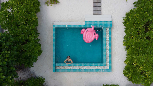 A Sunset Beach Villa with Pool at Ifuru Island Maldives from the air.