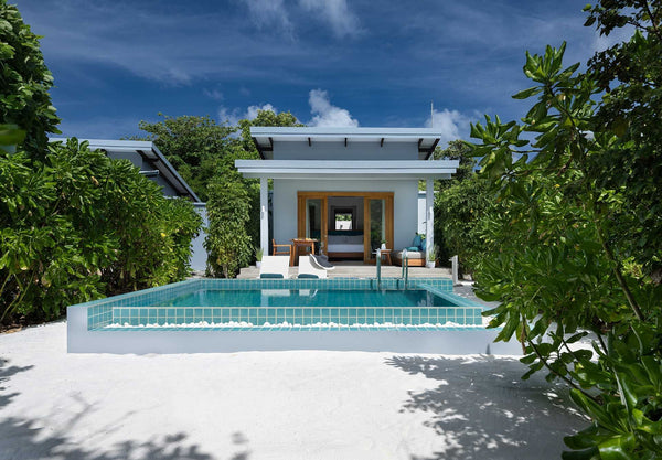 A Sunset Beach Villa with Pool at Ifuru Island Maldives.