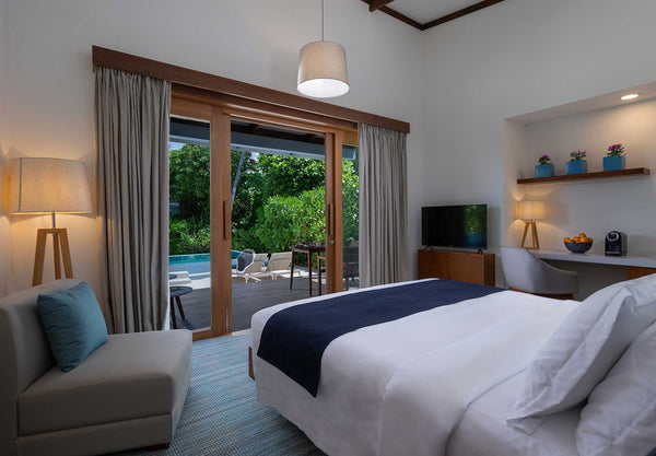 Inside a Sunset Beach Villa with Pool at Ifuru Island Maldives.