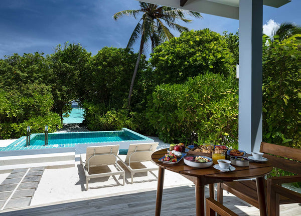The deck of a Sunset Beach Villa with Pool at Ifuru Island Maldives.
