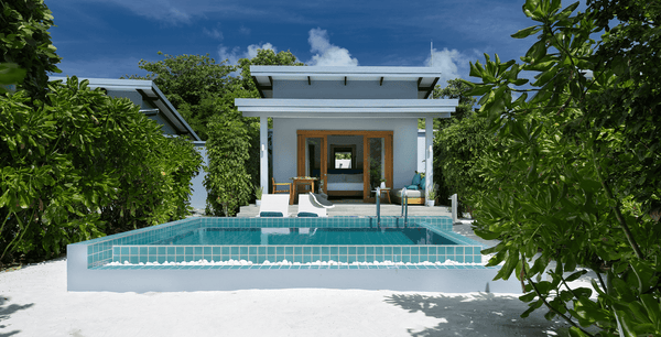 The outside of a Sunset Beach Villa with Pool at Ifuru Island Maldives.